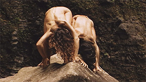 Kathi von Koerber and Atsushi Takenouchi bending down over rock