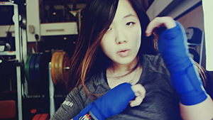 asian girl boxing towards camera