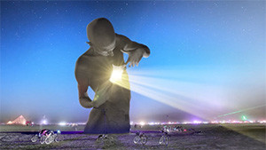 sculpture with light emanating from chest at burning man
