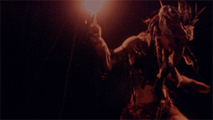 Ritual of Fire performer with flame and mask