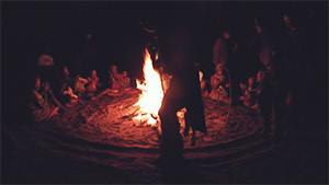 silhouette of tribal ritual by fire
