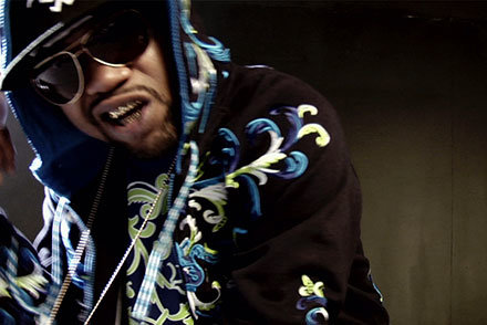 Juvenile music video rapper with sunglasses and hoodie