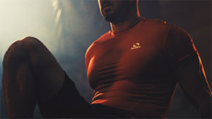 close up of athlete chest with form fitting red shirt